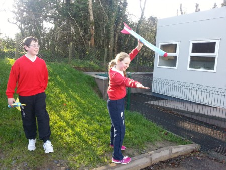Tadhg and Alannah practice their javelin skills.